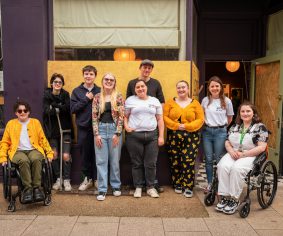 A group picture of the Access All Areas young producers with lead artist Helena Ascough, project assistant Maia, and Blaze Arts lead Helen.